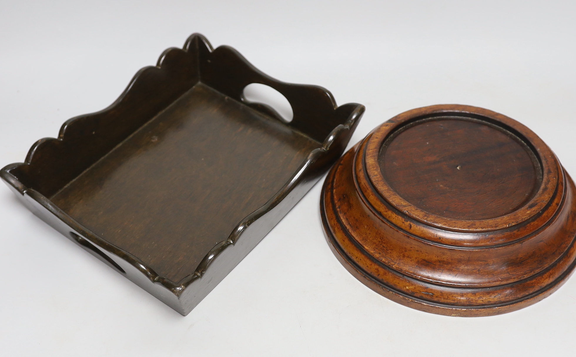 A pincushion stand with tray base, a mahogany vase stand and a hardwood mortar, tallest 22cm high